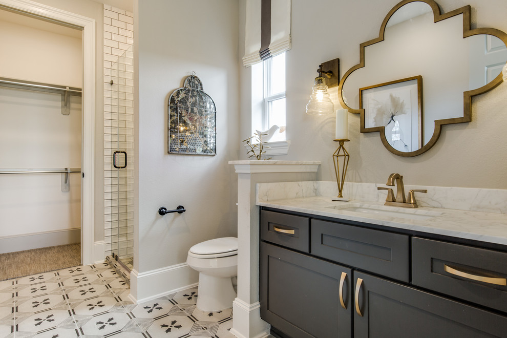 Transitional bathroom photo in Houston with a hinged shower door