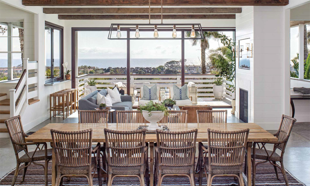 Photo of a mid-sized beach style dining room in San Diego.