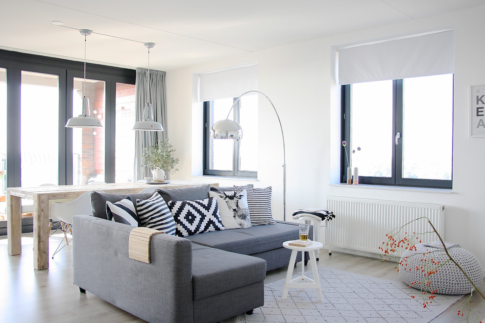 This is an example of a small scandinavian open concept living room in Amsterdam.