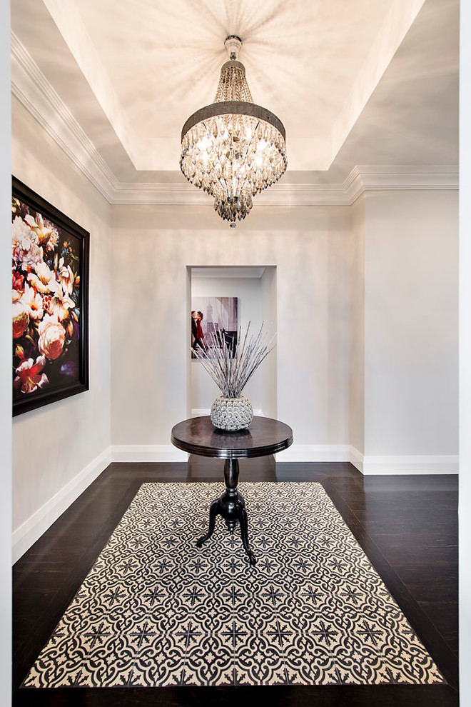 Inspiration for a transitional foyer in Perth with white walls and dark hardwood floors.