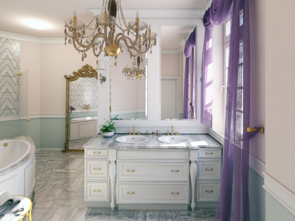 Inspiration for a mid-sized traditional master bathroom in Phoenix with furniture-like cabinets, white cabinets, a corner tub, beige tile, mosaic tile, marble benchtops, grey benchtops and grey floor.