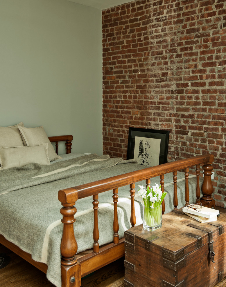 Inspiration for a traditional bedroom in New York with green walls.
