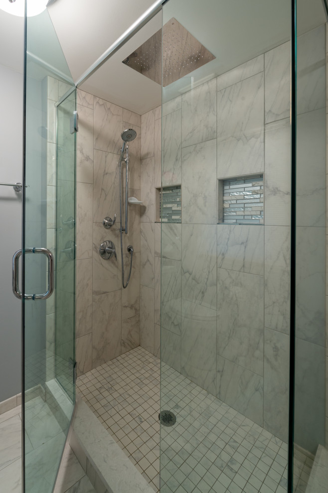 Photo of a mid-sized eclectic master bathroom in Chicago with recessed-panel cabinets, white cabinets, a freestanding tub, a double shower, a two-piece toilet, multi-coloured tile, porcelain tile, grey walls, porcelain floors, an undermount sink, engineered quartz benchtops, multi-coloured floor, a hinged shower door and multi-coloured benchtops.