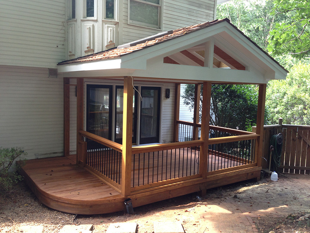 Inspiration for a mid-sized transitional side yard deck remodel in Raleigh with a roof extension