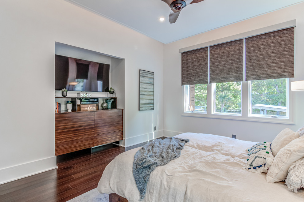 This is an example of a contemporary master bedroom in Other with bamboo floors and recessed.