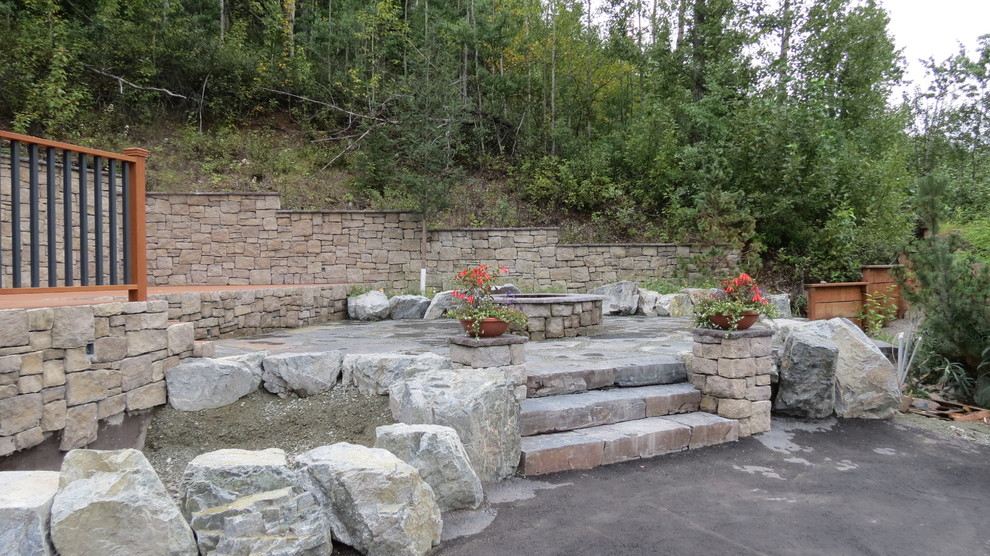 Inspiration for a mid-sized rustic side yard concrete paver landscaping.