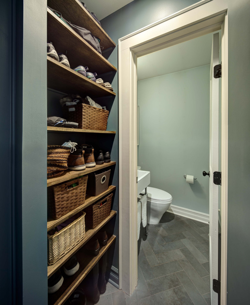 Design ideas for a small country built-in wardrobe in New York with slate flooring and grey floors.
