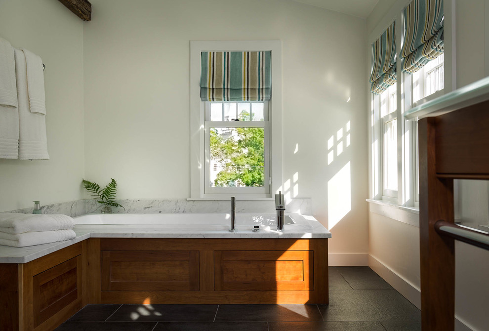 Inspiration for a mid-sized traditional master bathroom in Bridgeport with shaker cabinets, medium wood cabinets, a freestanding tub, marble benchtops, marble, an alcove shower, white walls, ceramic floors, an undermount sink, grey floor and an open shower.