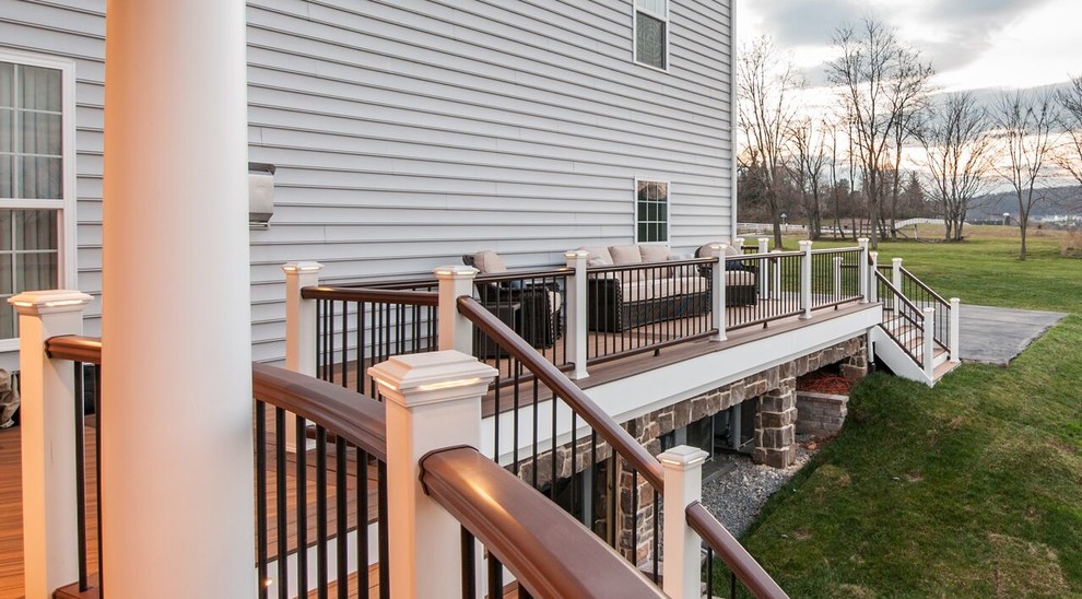 Photo of a large traditional backyard deck in DC Metro with no cover.