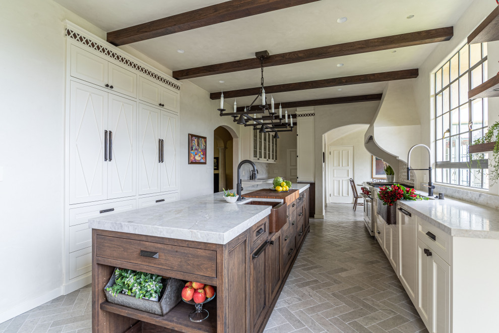 Medium sized traditional grey and cream galley kitchen in San Francisco with a belfast sink, dark wood cabinets, quartz worktops, stainless steel appliances, limestone flooring, an island, grey floors, exposed beams and white worktops.