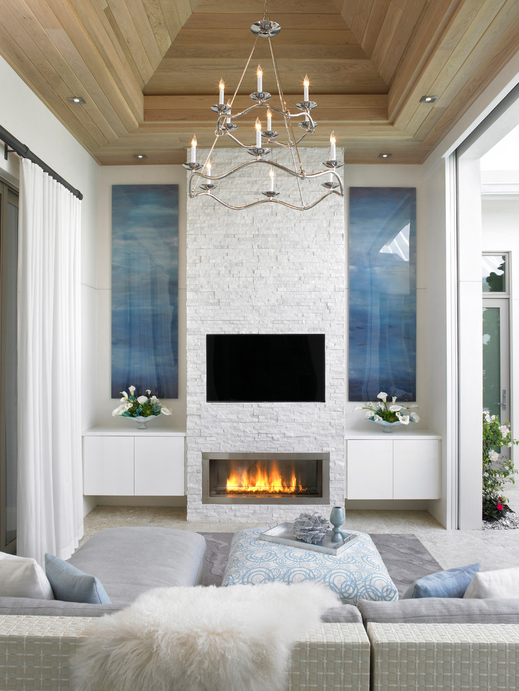 Inspiration for a large modern formal open concept living room in Miami with white walls, ceramic floors, a ribbon fireplace, a brick fireplace surround, a wall-mounted tv and grey floor.