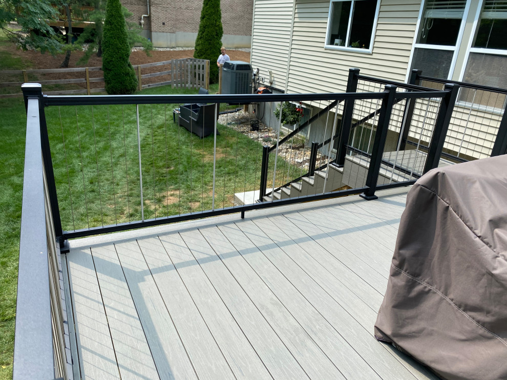 Example of a large transitional backyard second story metal railing deck design in Cincinnati