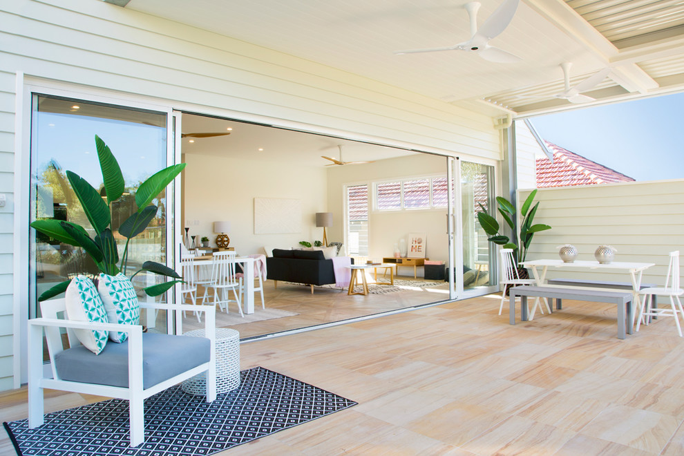 This is an example of a beach style deck in Sydney.