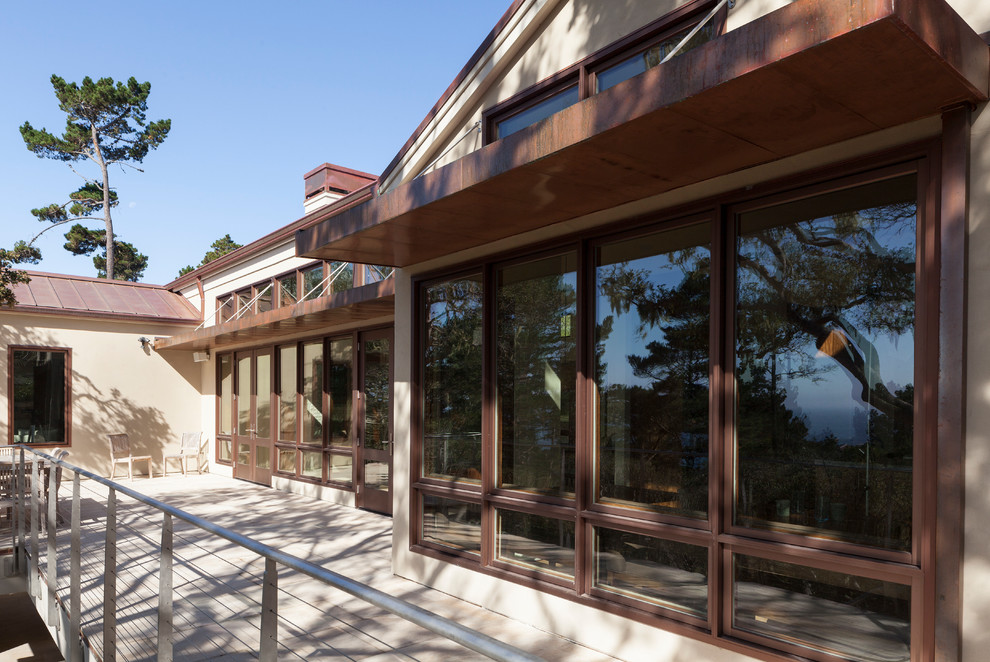 Inspiration for a large transitional backyard patio remodel with decking and no cover