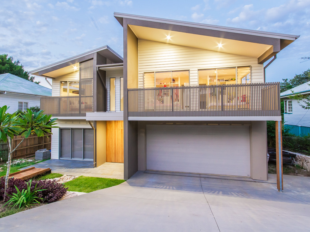 Design ideas for a large contemporary two-storey multi-coloured house exterior in Brisbane with mixed siding and a metal roof.