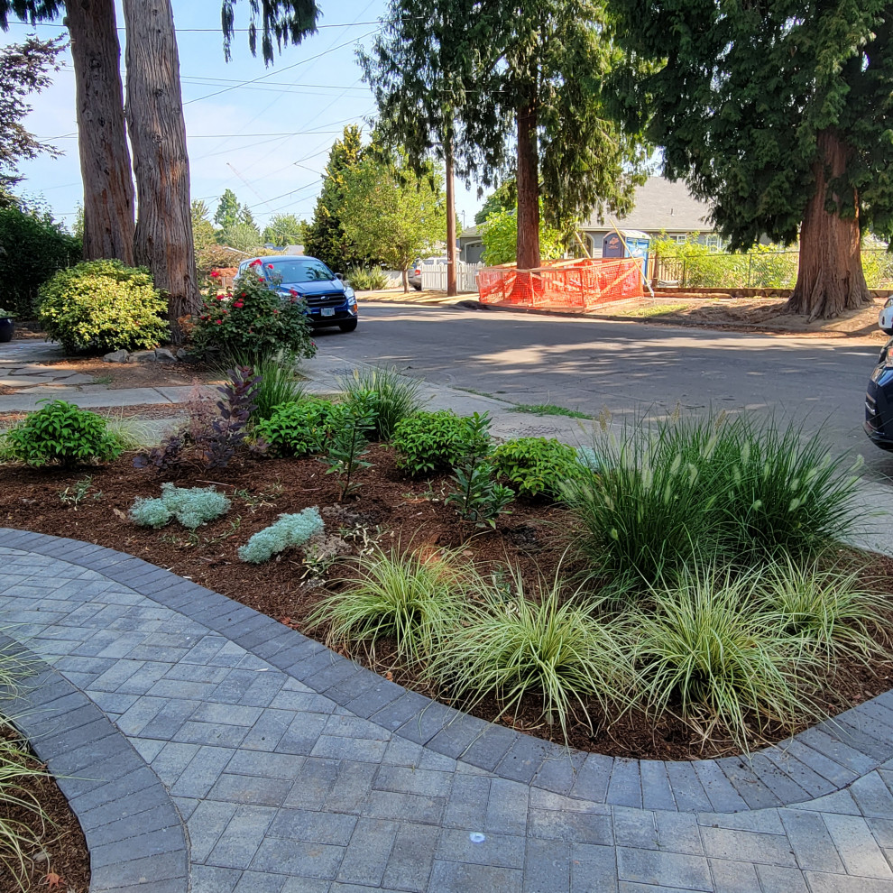 Photo of a small traditional drought-tolerant and partial sun front yard concrete paver walkway in Portland for summer.