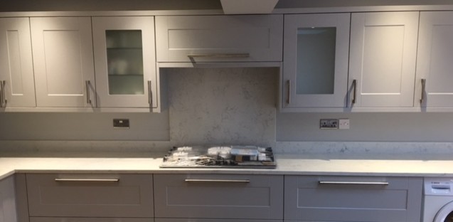 Inspiration for a contemporary kitchen in Essex with quartzite benchtops and with island.