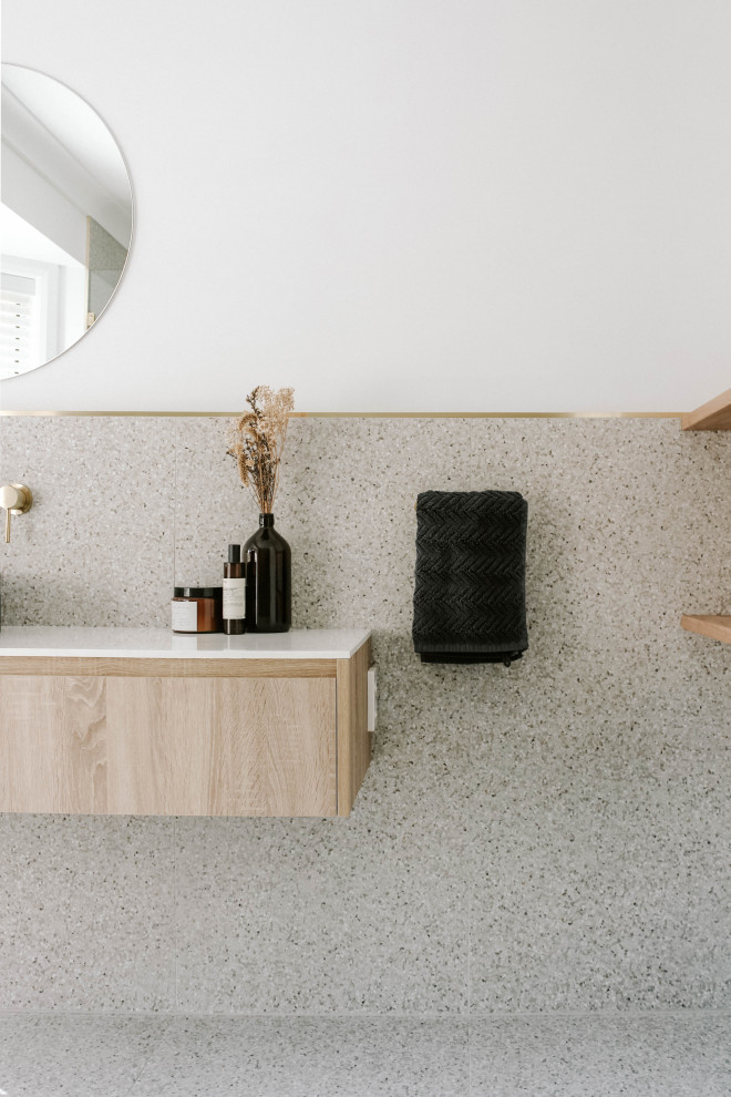 This is an example of an industrial master bathroom in Gold Coast - Tweed with blue cabinets, ceramic tile, white walls, terrazzo floors, a vessel sink, granite benchtops, white benchtops, a single vanity and a floating vanity.