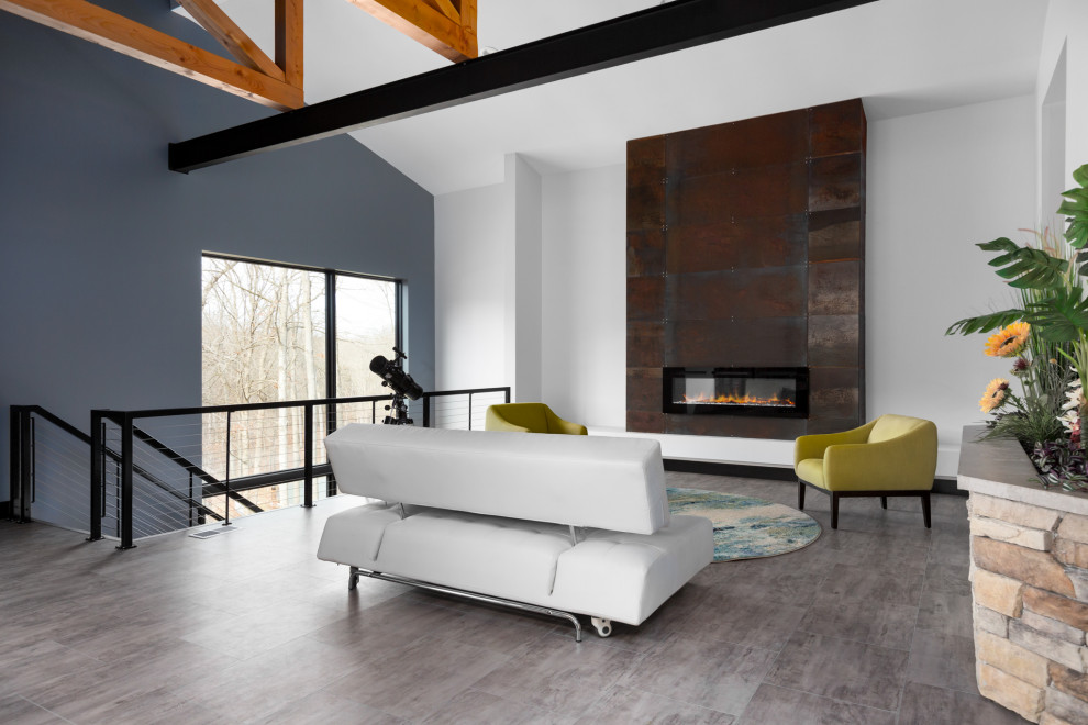 Large midcentury formal open plan living room in St Louis with white walls, vinyl flooring, a hanging fireplace, a metal fireplace surround, no tv, grey floors and exposed beams.