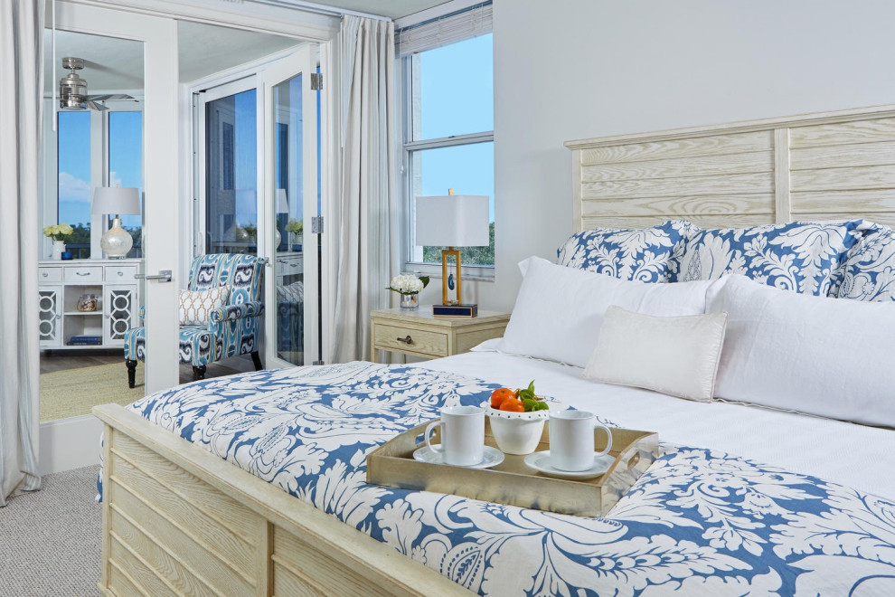 Design ideas for a mid-sized beach style master bedroom in Miami with white walls.