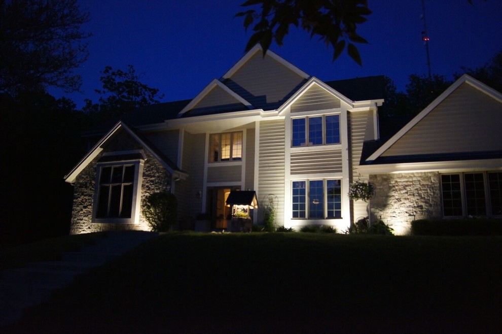 Large transitional gray two-story mixed siding exterior home photo