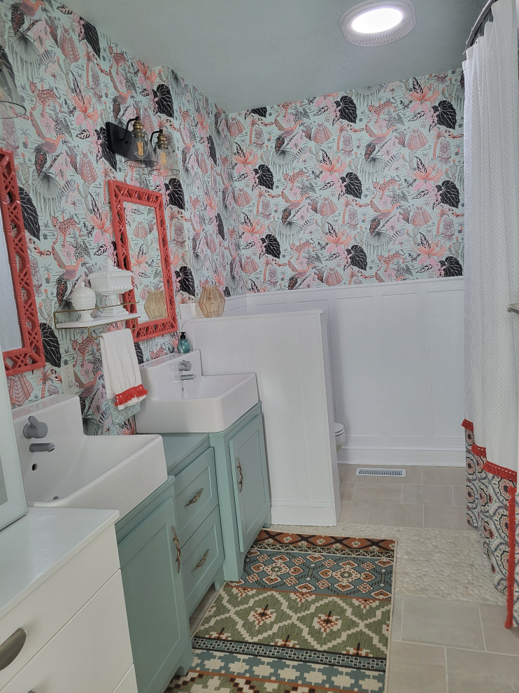 Bathroom - small eclectic kids' multicolored tile and mosaic tile porcelain tile, beige floor, double-sink and wallpaper bathroom idea in Minneapolis with recessed-panel cabinets, green cabinets, a one-piece toilet, blue walls, a trough sink, wood countertops, green countertops and a built-in vanity