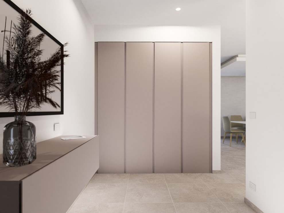 This is an example of a medium sized contemporary foyer in Milan with white walls, porcelain flooring, a single front door, a grey front door, grey floors and a drop ceiling.