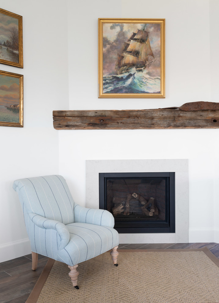 Transitional home design photo with a corner fireplace and a stone fireplace