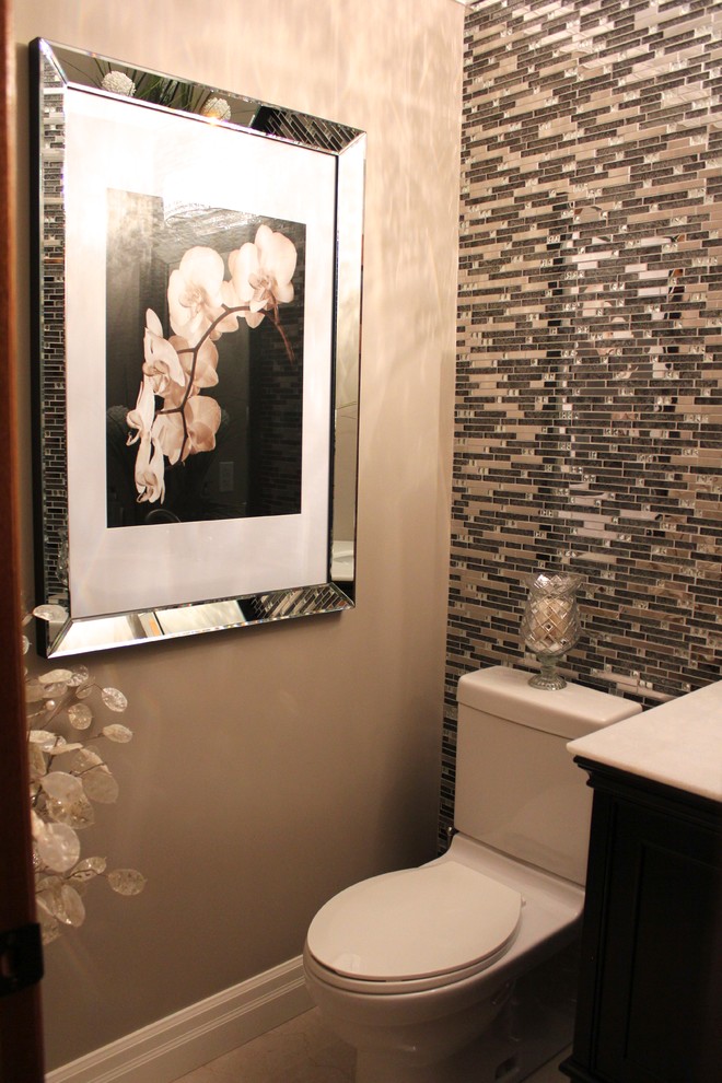 Inspiration for a small transitional powder room in Toronto with an undermount sink, a one-piece toilet, marble benchtops, mosaic tile, porcelain floors and beige walls.