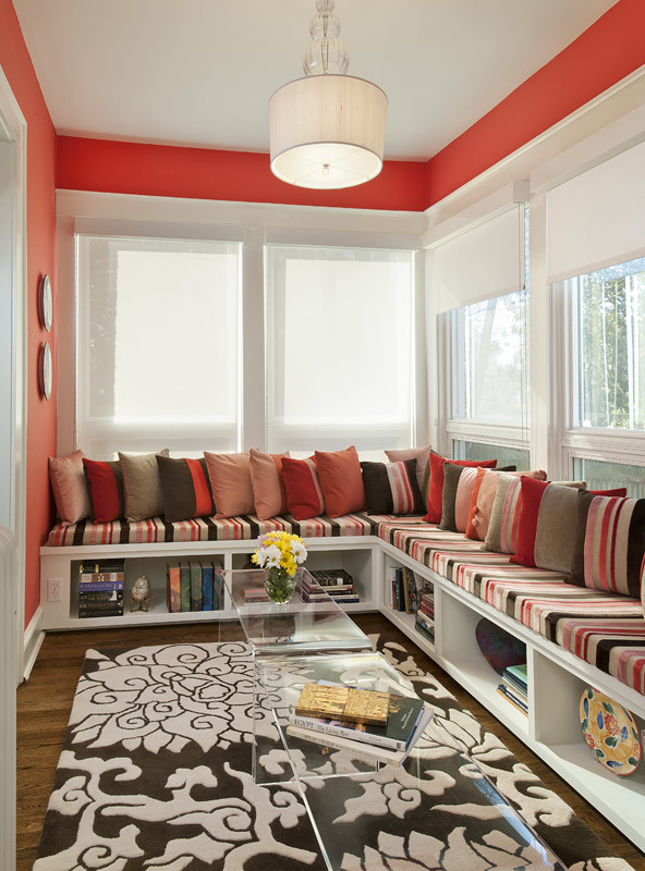 Inspiration for a contemporary family room in DC Metro with a library, red walls and medium hardwood floors.