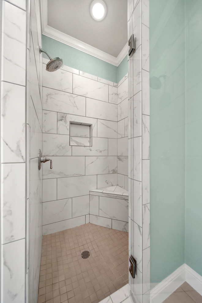 Inspiration for a medium sized classic ensuite bathroom in Austin with shaker cabinets, white cabinets, a freestanding bath, an alcove shower, a one-piece toilet, grey tiles, porcelain tiles, green walls, porcelain flooring, a submerged sink, granite worktops, grey floors, a hinged door, grey worktops, an enclosed toilet, double sinks and a built in vanity unit.