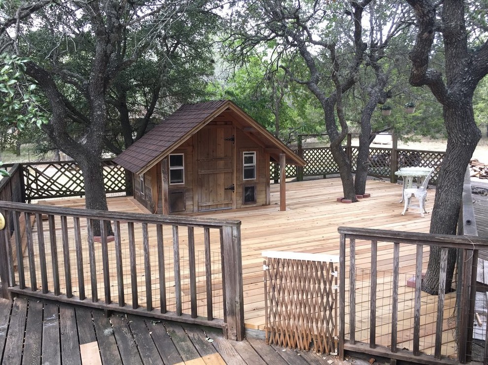 Deck - large rustic backyard deck idea in Austin with no cover