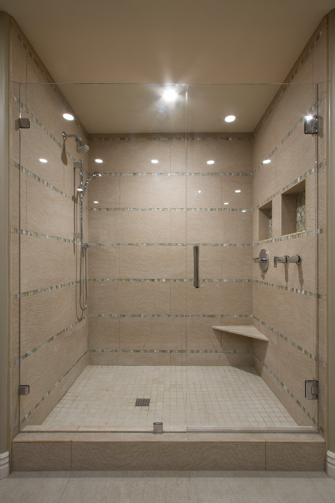 This is an example of a mid-sized contemporary master bathroom in Phoenix with flat-panel cabinets, medium wood cabinets, an alcove shower, a two-piece toilet, beige tile, porcelain tile, beige walls, porcelain floors, a drop-in sink, quartzite benchtops, beige floor, a hinged shower door and beige benchtops.