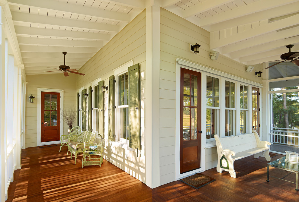 Inspiration for a mid-sized beach style verandah in Charleston with decking and a roof extension.