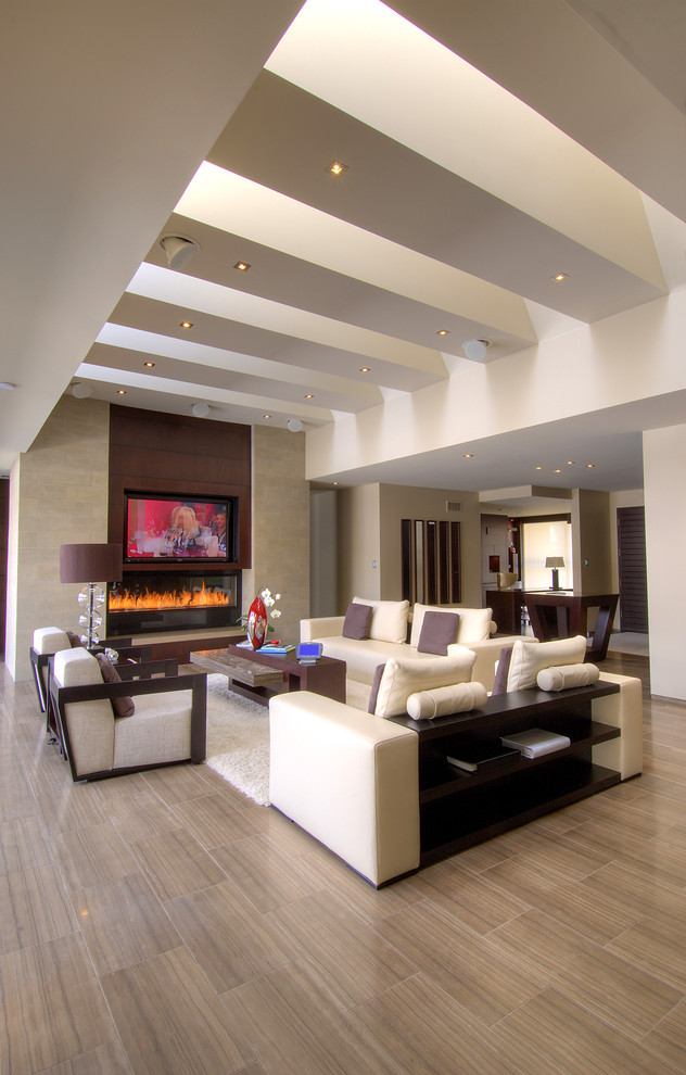 Large contemporary formal open concept living room in Toronto with beige walls, porcelain floors, a ribbon fireplace, a stone fireplace surround, a built-in media wall and brown floor.