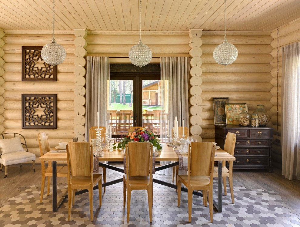 Photo of a mid-sized country open plan dining in Moscow with dark hardwood floors and beige walls.