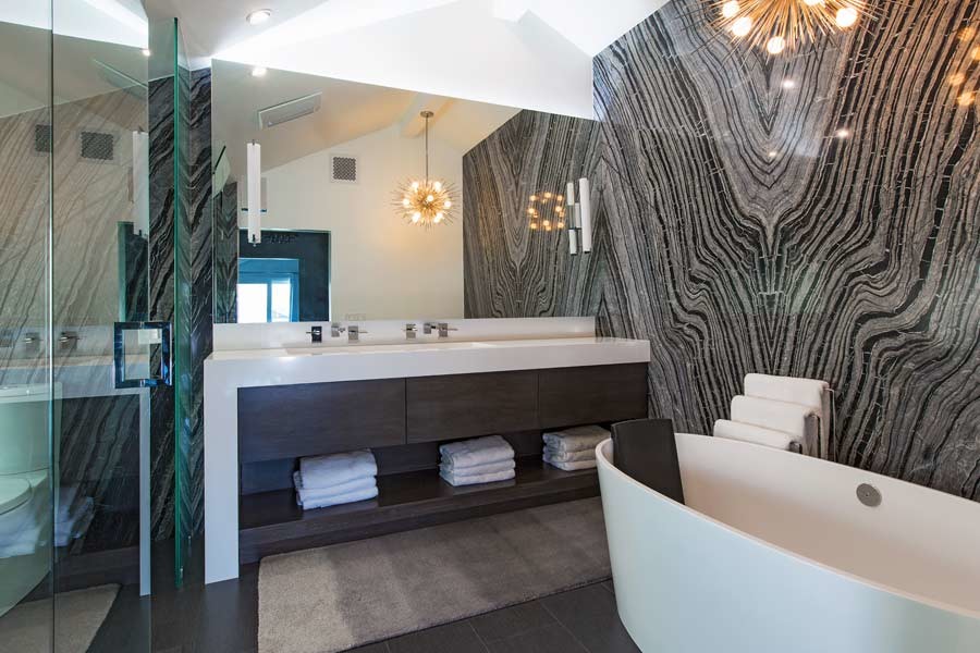 Inspiration for a mid-sized midcentury master bathroom in Los Angeles with flat-panel cabinets, dark wood cabinets, a freestanding tub, a corner shower, a two-piece toilet, white walls, dark hardwood floors, a trough sink and solid surface benchtops.