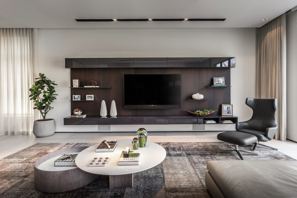 Inspiration for a large contemporary open concept family room in Miami with white walls, porcelain floors, a built-in media wall and grey floor.