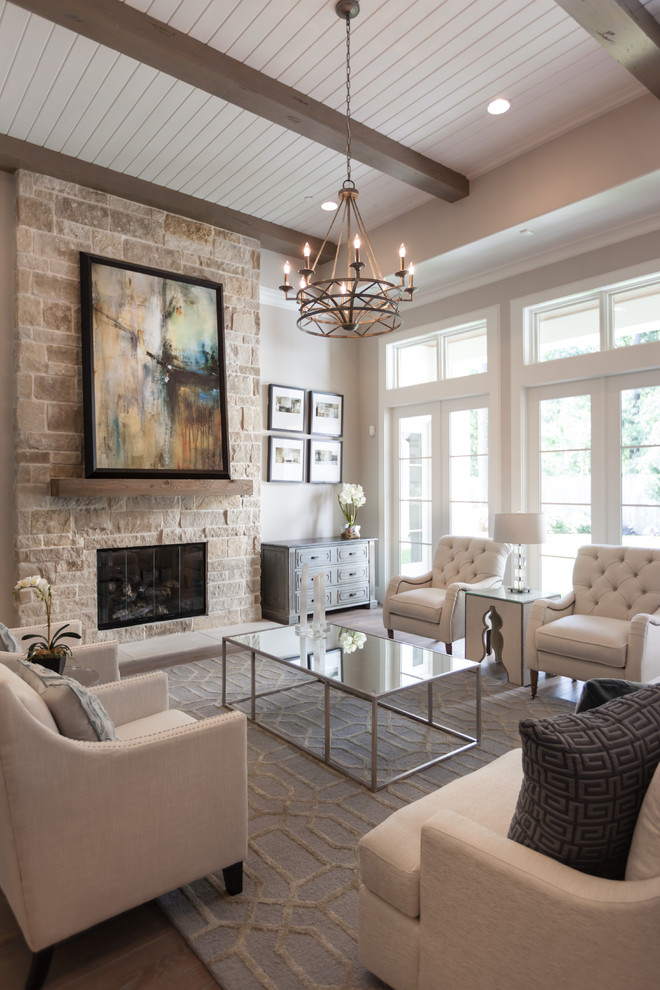 Elegant dark wood floor living room photo in Houston with gray walls, a standard fireplace and a stone fireplace