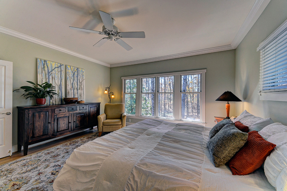 This is an example of a contemporary bedroom in Raleigh.