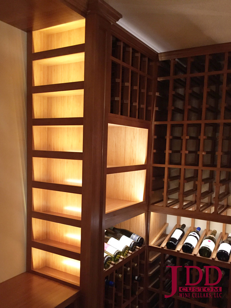 Inspiration for a large country wine cellar in San Diego with travertine floors and storage racks.