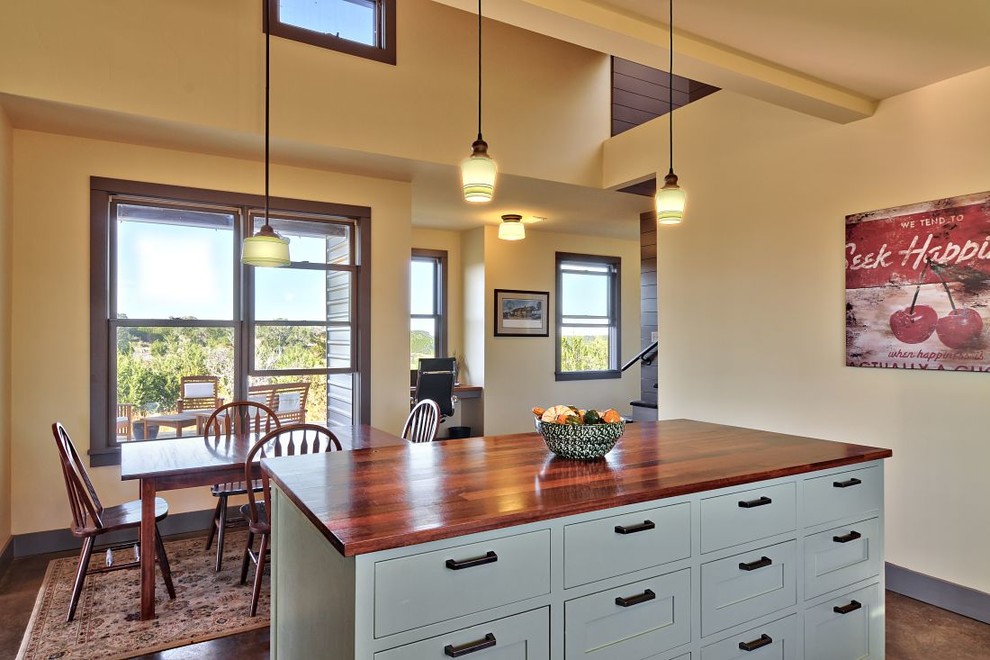Inspiration for a country eat-in kitchen in Austin with shaker cabinets, grey cabinets and wood benchtops.