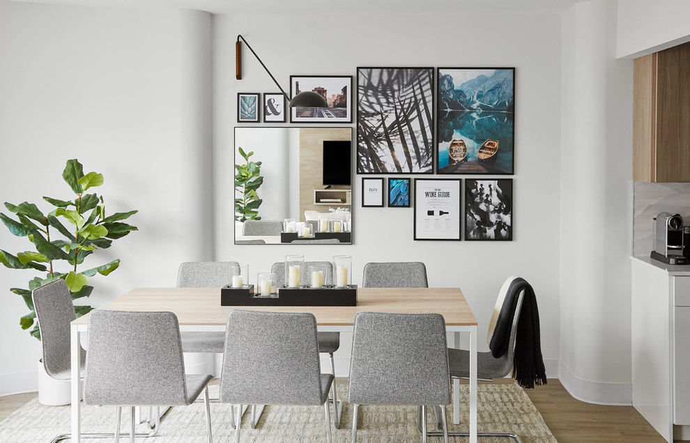 Trendy light wood floor great room photo in Chicago with white walls and no fireplace