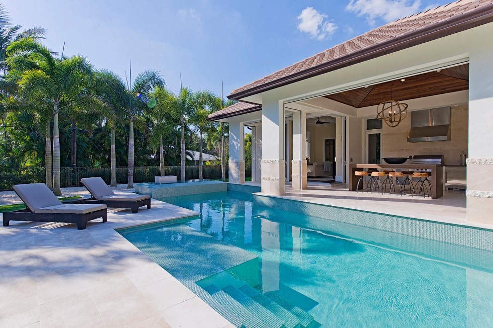 Photo of a mediterranean custom-shaped pool in Miami.