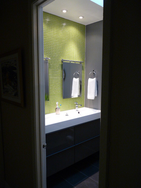 Small contemporary bathroom in Montreal with mosaic tile and green walls.
