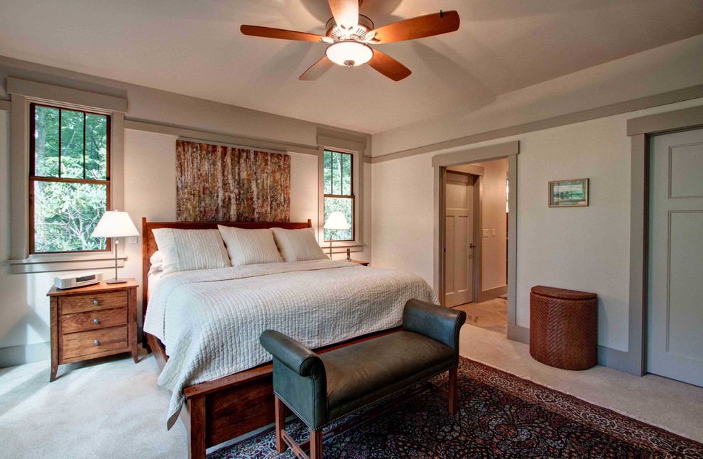 This is an example of an arts and crafts master bedroom in Other with grey walls, carpet and no fireplace.