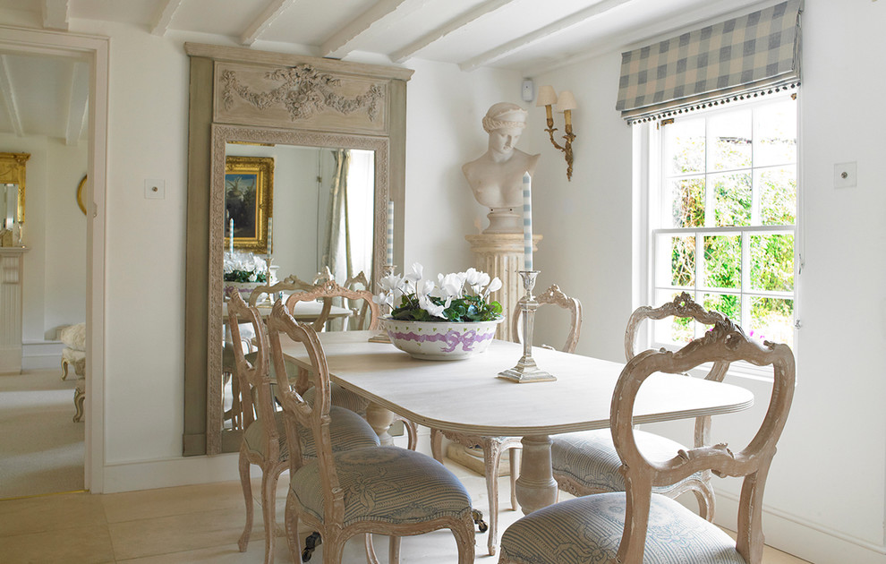 Photo of a traditional separate dining room in Wiltshire with white walls, light hardwood floors and no fireplace.