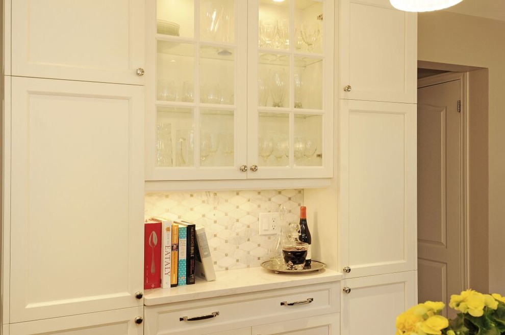 Mid-sized transitional l-shaped medium tone wood floor kitchen photo in Ottawa with a double-bowl sink, recessed-panel cabinets, white cabinets, quartz countertops, gray backsplash, stone tile backsplash, stainless steel appliances and an island