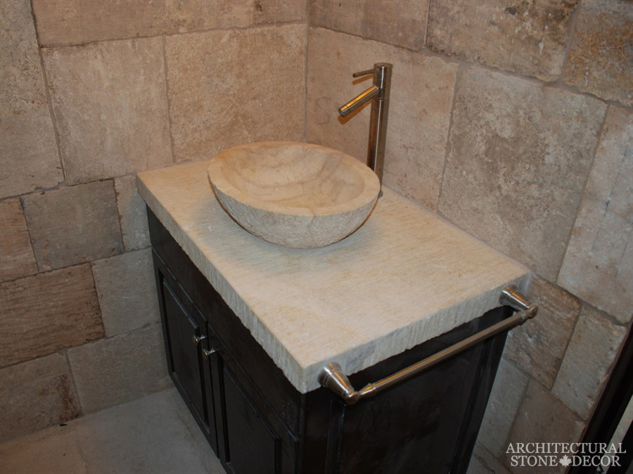 Inspiration for a mid-sized mediterranean 3/4 bathroom in Toronto with multi-coloured tile, limestone, multi-coloured walls, limestone floors and limestone benchtops.