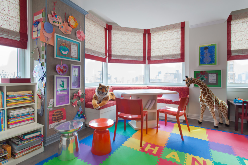 Large trendy gender-neutral medium tone wood floor and brown floor kids' room photo in New York with beige walls